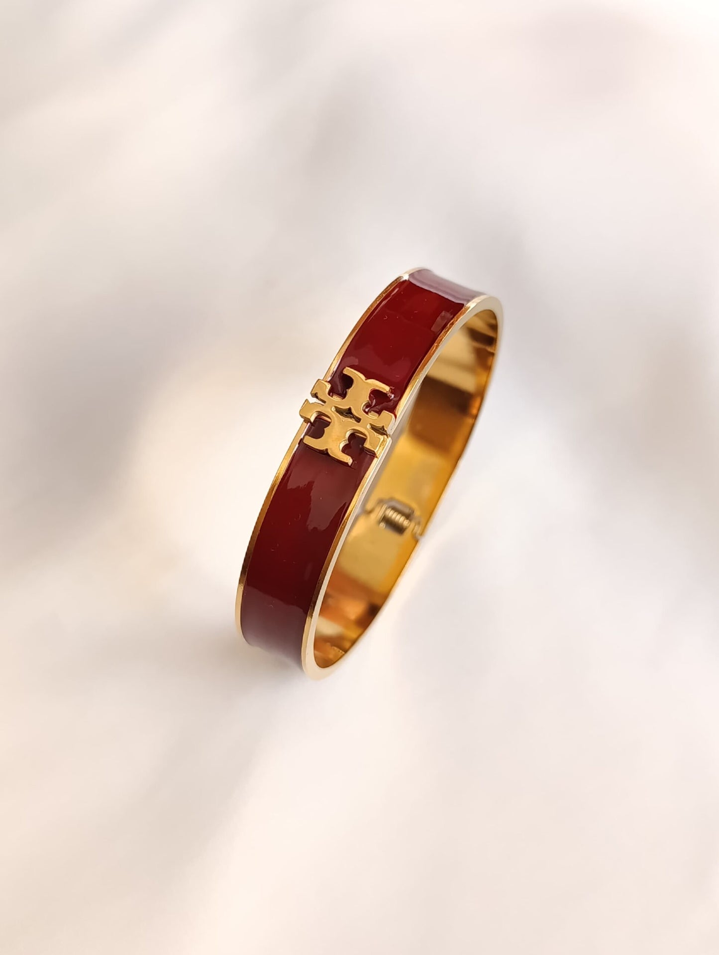 Gold & Burgundy Enamel Bracelet with Designer Logo – Elegant Fashion Jewelry